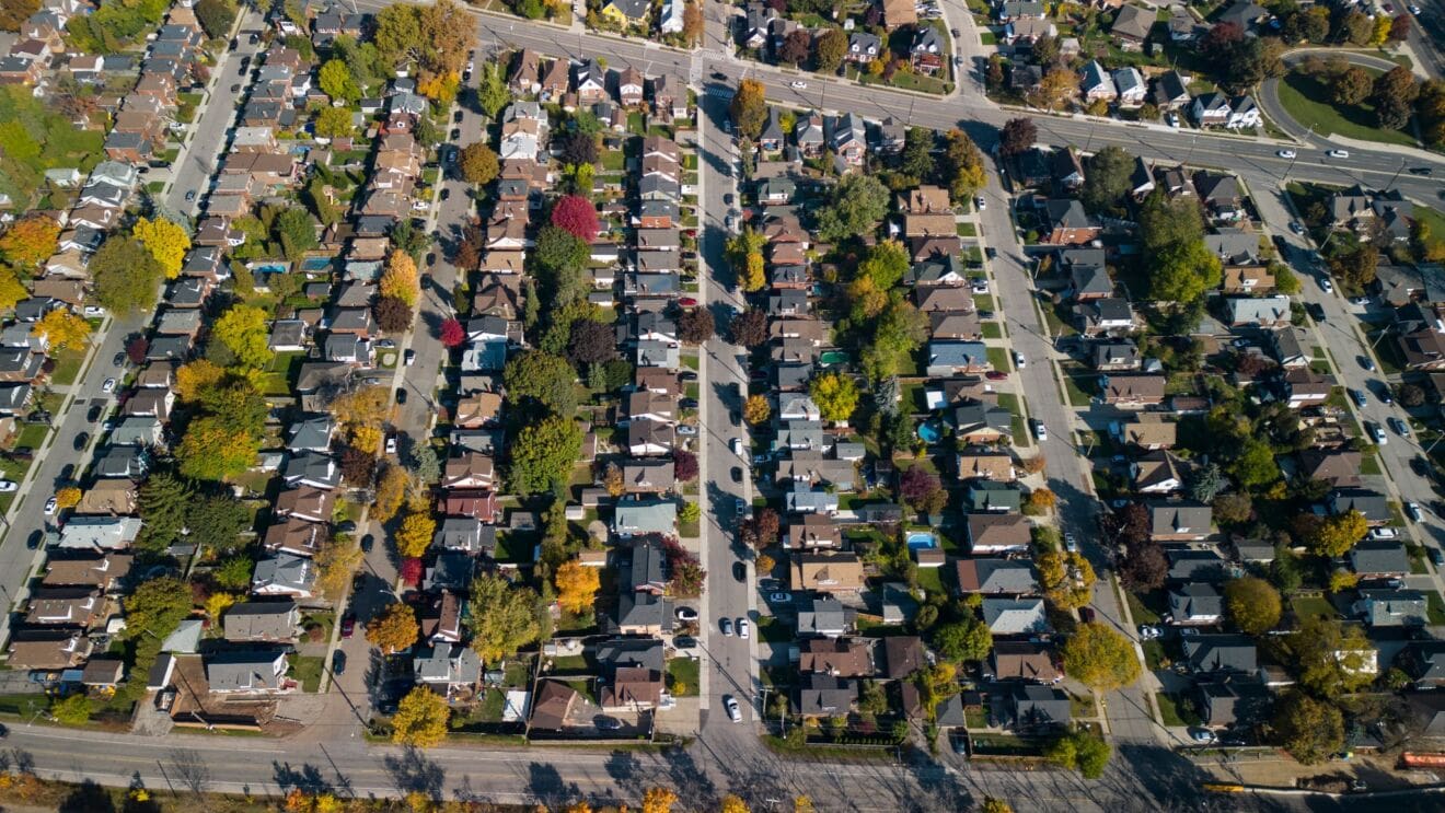 Aerial view of residential streets and autumn trees illustrating the Binbrook Hamilton neighbourhood guide.