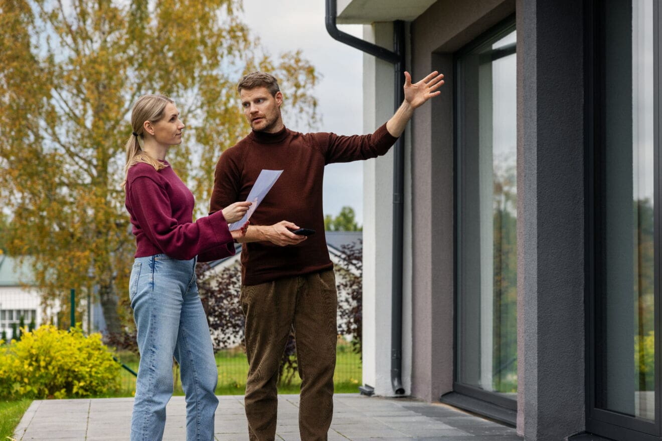 Real estate agent discussing home options with a buyer exploring Niagara Falls neighbourhoods.